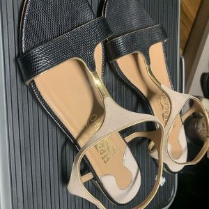 Salvatore Ferragamo flat sandals with skin texture in black, beige and gold heel